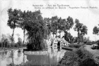 carte postale ancienne de Nederbrakel Parc des Top Bronnen - Grottes où jaillissent les Sources - Propriétaire François Hoebeke